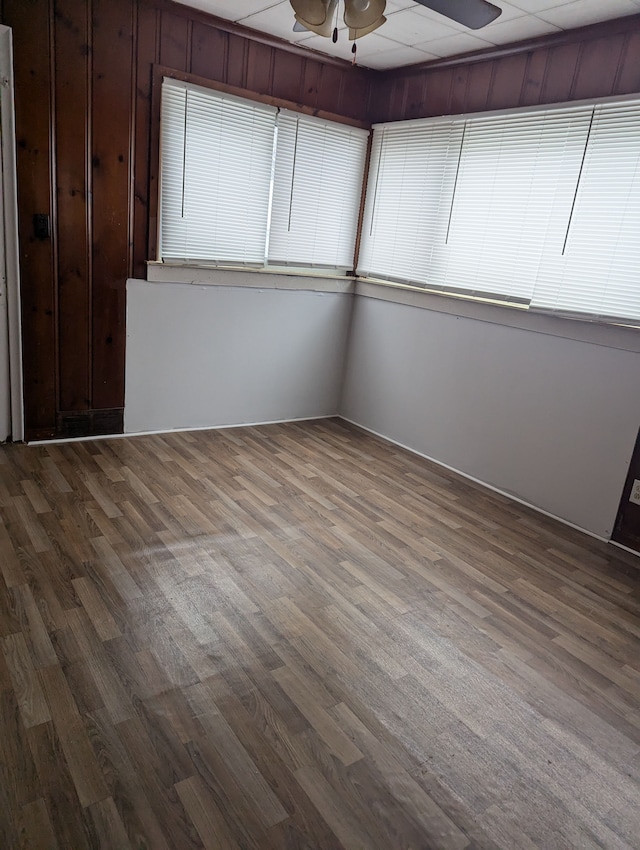 unfurnished room with hardwood / wood-style floors and ceiling fan