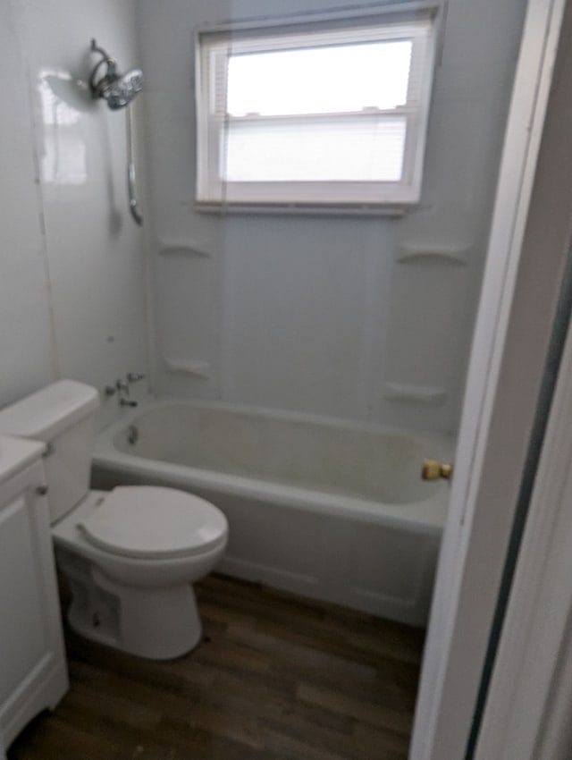 full bathroom with vanity,  shower combination, toilet, and wood-type flooring