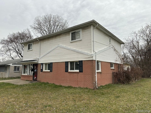 26202 Colgate St, Inkster, MI 48141 - view of side of home with brick siding and a lawn