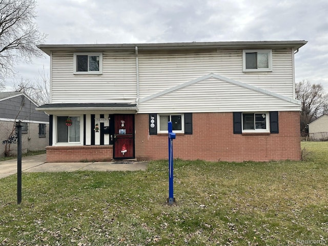 26202 Colgate St, Inkster, MI 48141 - view of front of property featuring a front yard, brick siding, and a porch