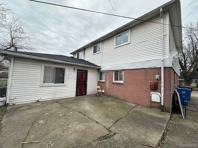 26202 Colgate St, Inkster, MI 48141 - back of house with brick siding and a patio