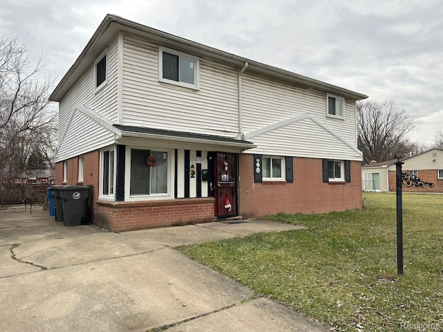 26202 Colgate St, Inkster, MI 48141 - traditional-style home with brick siding and a front lawn