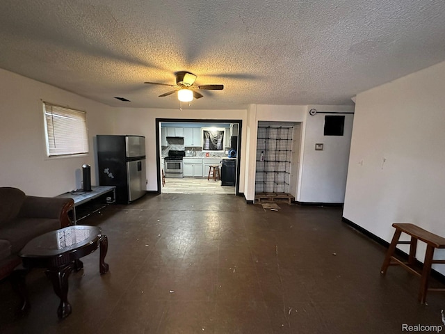 26202 Colgate St, Inkster, MI 48141 - living room featuring ceiling fan and a textured ceiling