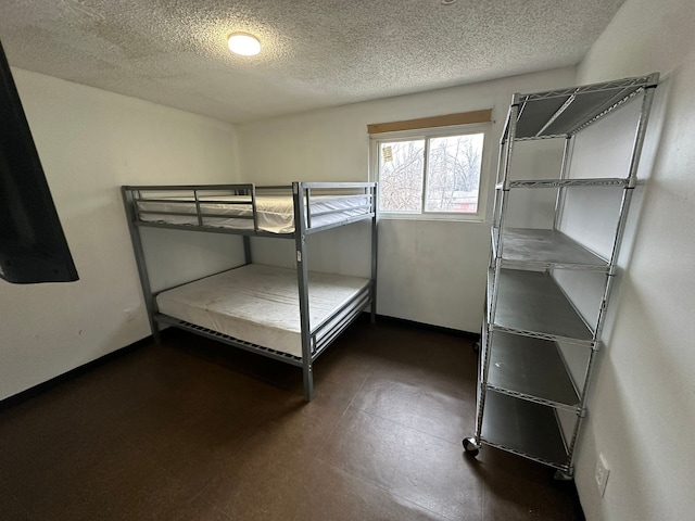 unfurnished bedroom featuring a textured ceiling