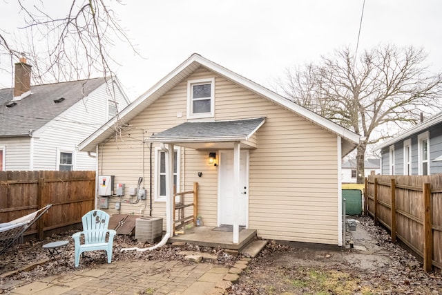 back of property with a patio area and central AC unit