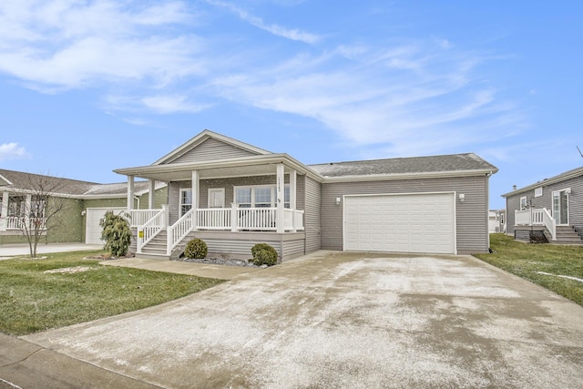 view of front of property with covered porch, a front yard, and a garage