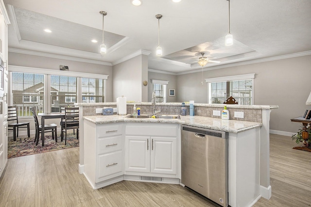 kitchen with ceiling fan, dishwasher, sink, a tray ceiling, and white cabinets