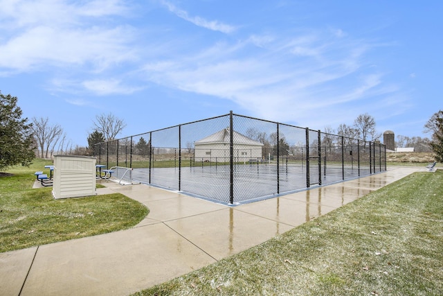 exterior space with a lawn and tennis court