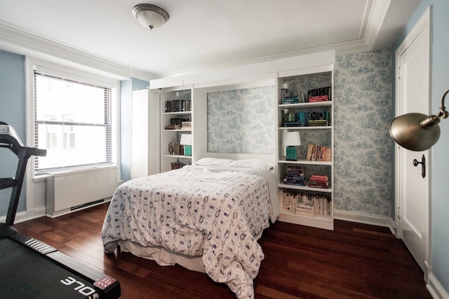 bedroom featuring dark hardwood / wood-style flooring and crown molding