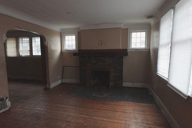 living room with a fireplace and dark hardwood / wood-style floors