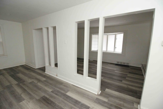 empty room featuring dark hardwood / wood-style floors