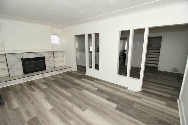 unfurnished living room with wood-type flooring