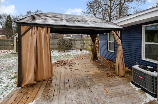 wooden terrace featuring a gazebo and central AC unit