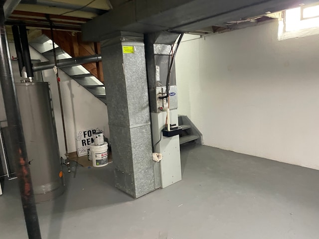 utilities featuring heating unit and gas water heater