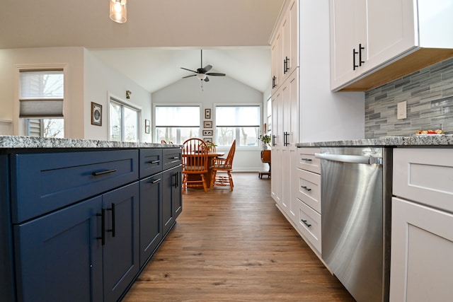 kitchen featuring blue cabinetry, ceiling fan, white cabinets, and stainless steel dishwasher