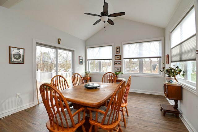 dining space featuring dark hardwood / wood-style floors, ceiling fan, and lofted ceiling