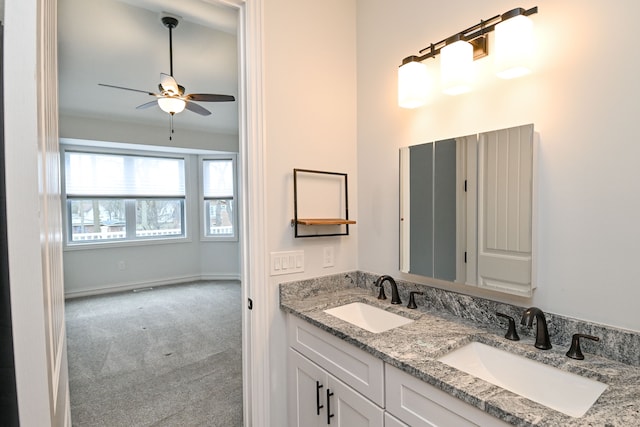 bathroom featuring ceiling fan and vanity