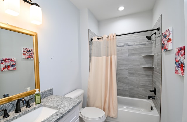 full bathroom featuring toilet, vanity, and shower / tub combo with curtain