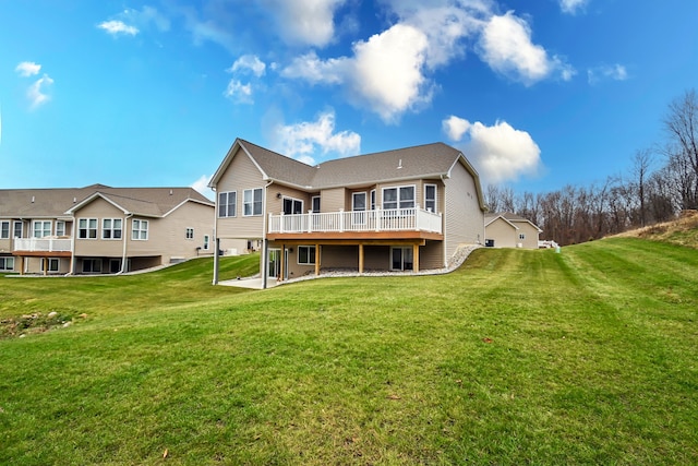 back of house with a yard and a deck