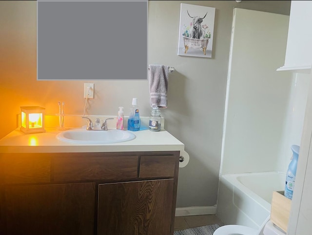 bathroom featuring tile patterned floors, vanity, and a bath