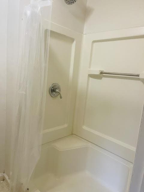 bathroom featuring walk in shower