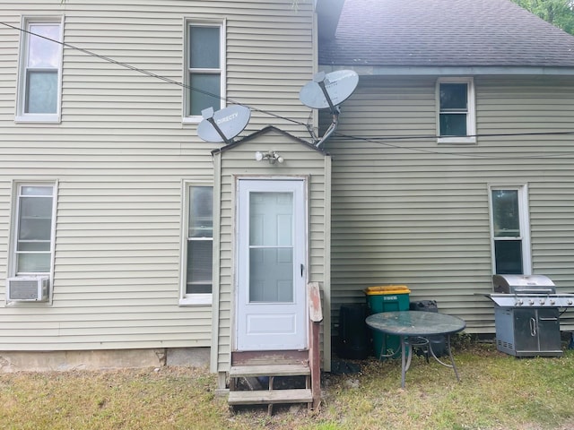 doorway to property with cooling unit