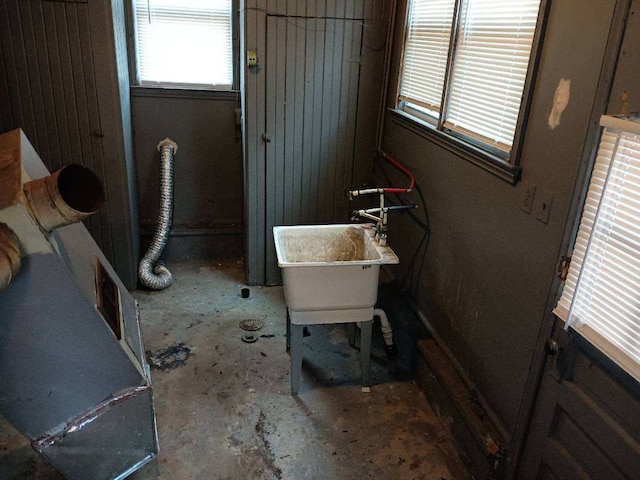 bathroom with a washtub and sink