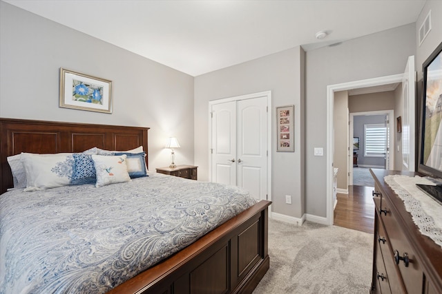 carpeted bedroom featuring a closet