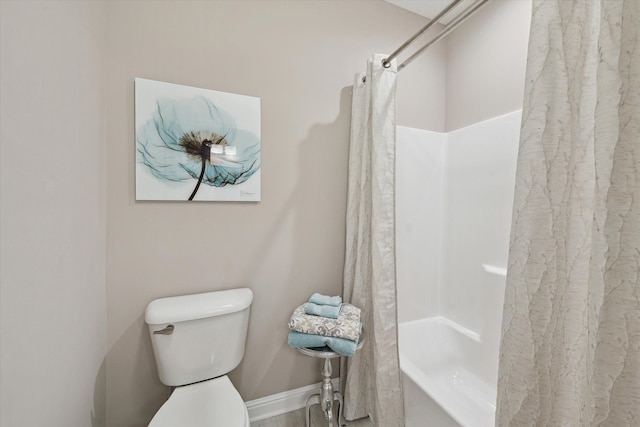 bathroom with toilet and shower / bathtub combination with curtain