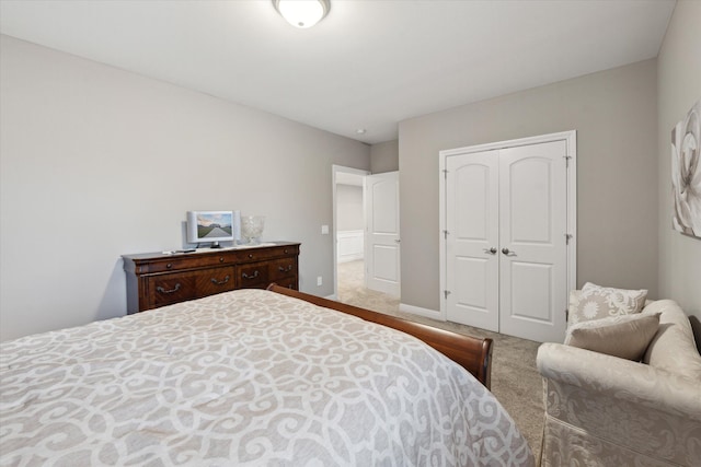 carpeted bedroom with a closet