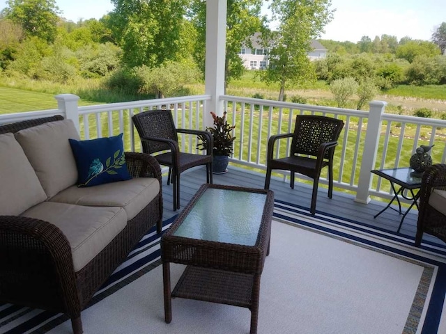 wooden deck featuring outdoor lounge area