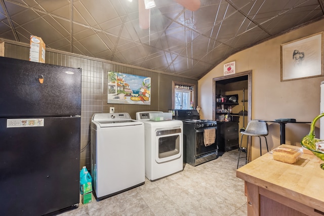 clothes washing area with washing machine and clothes dryer