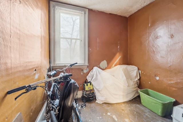 miscellaneous room with a textured ceiling