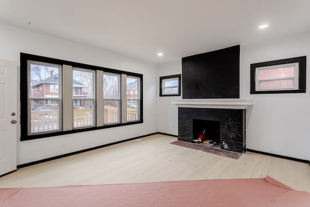 unfurnished living room with light wood-type flooring