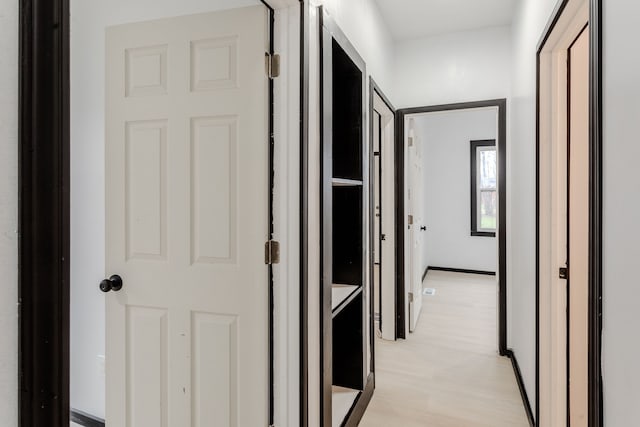 hallway with light wood-type flooring