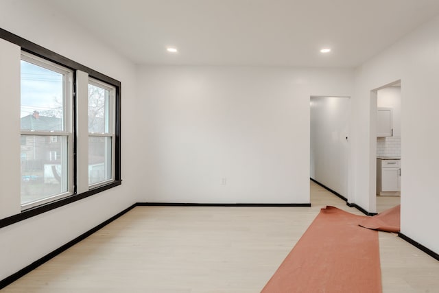 unfurnished room featuring light wood-type flooring