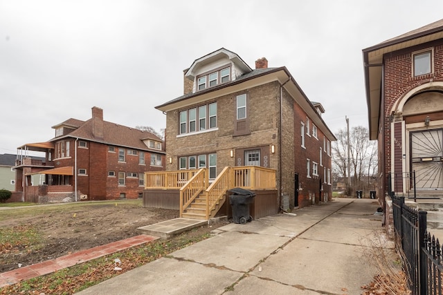 rear view of property with a deck