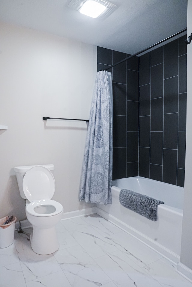 bathroom with shower / bath combo with shower curtain and toilet