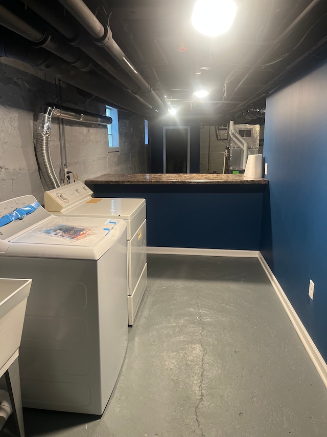 laundry room with washing machine and clothes dryer