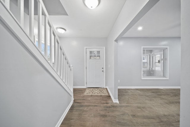 140 Stanley Ave, Jackson, MI 49203 - foyer entrance featuring stairs, baseboards, and wood finished floors