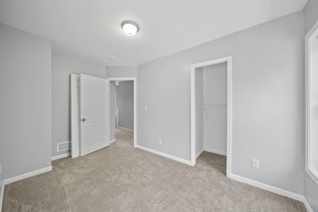 140 Stanley Ave, Jackson, MI 49203 - unfurnished bedroom with carpet flooring, a closet, and baseboards