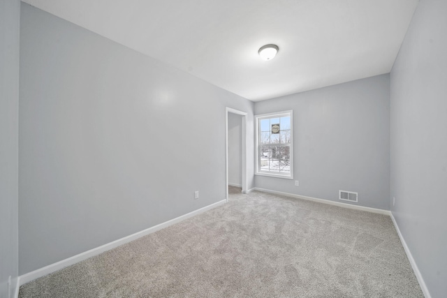 140 Stanley Ave, Jackson, MI 49203 - carpeted empty room with baseboards