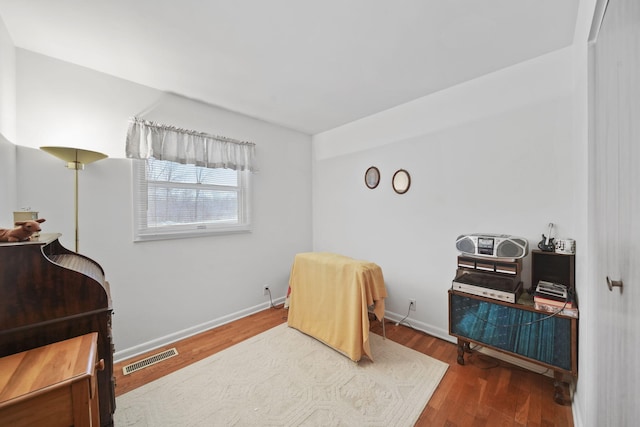 bedroom with hardwood / wood-style floors