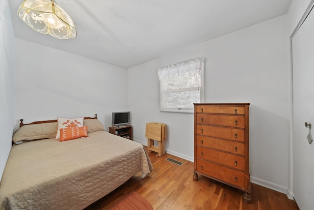 bedroom with light hardwood / wood-style floors