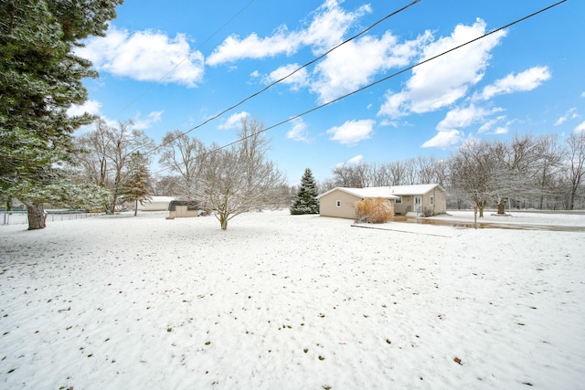 view of yard covered in snow