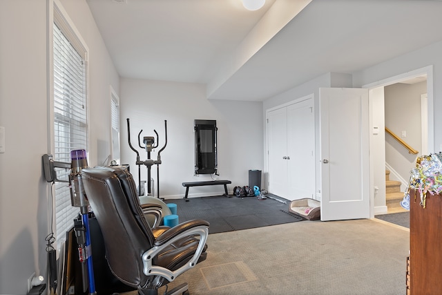 workout area with dark carpet