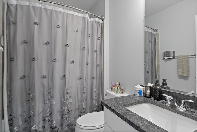 bathroom with vanity, a shower with curtain, and toilet