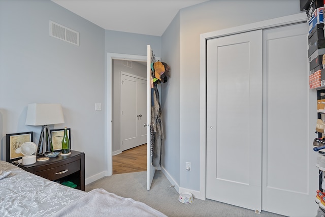 carpeted bedroom featuring a closet