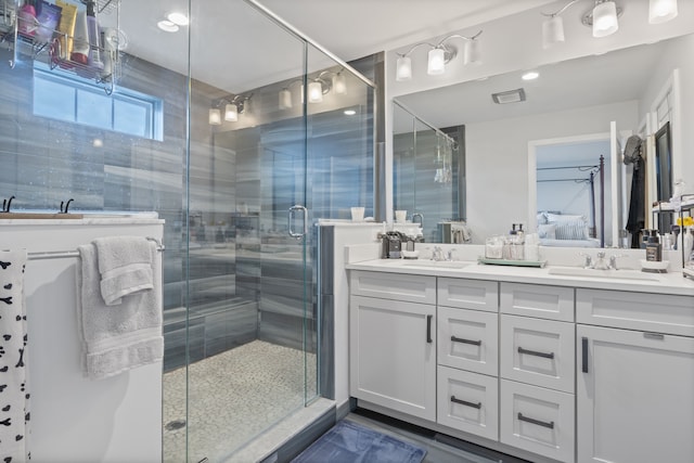 bathroom with vanity and walk in shower