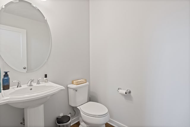 bathroom featuring toilet